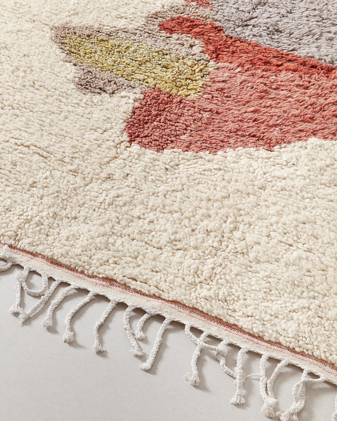 Berber rug with an earth-tone palette, close