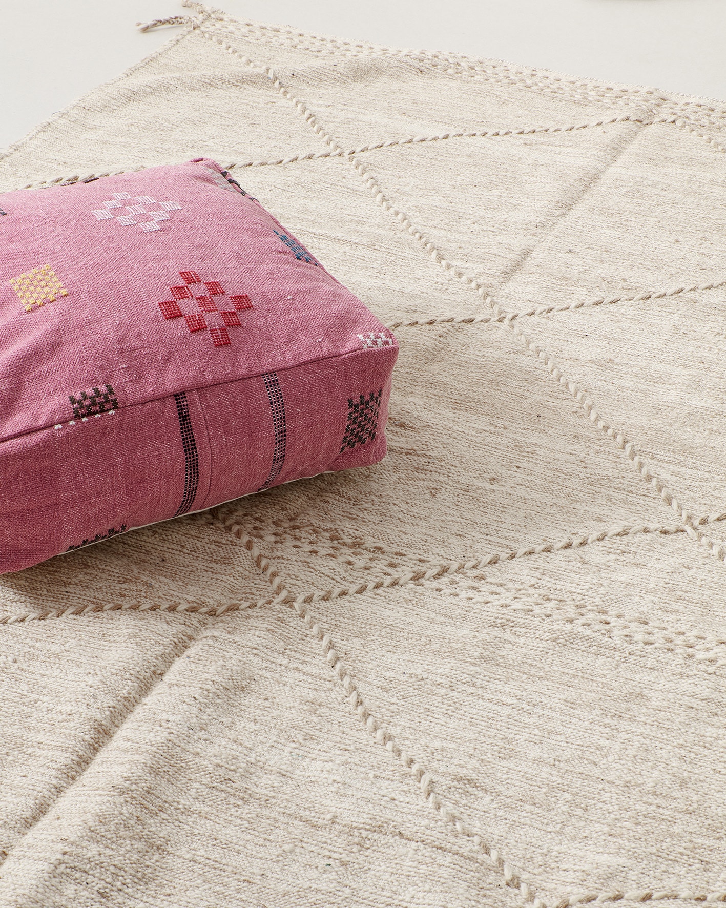 Pink pouf with colourful pictograms, mood