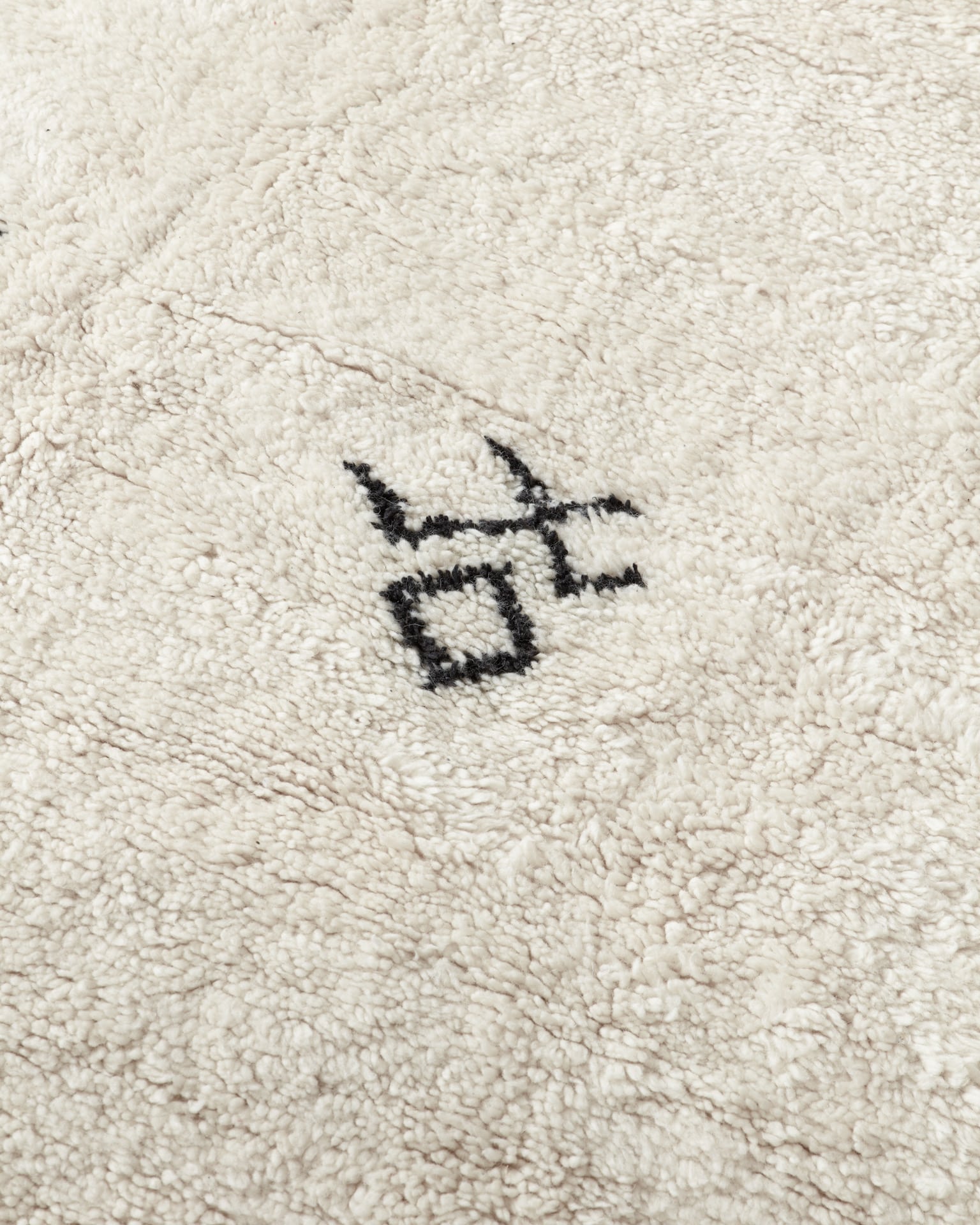 Beni Ourain rug with tattoo motifs, close