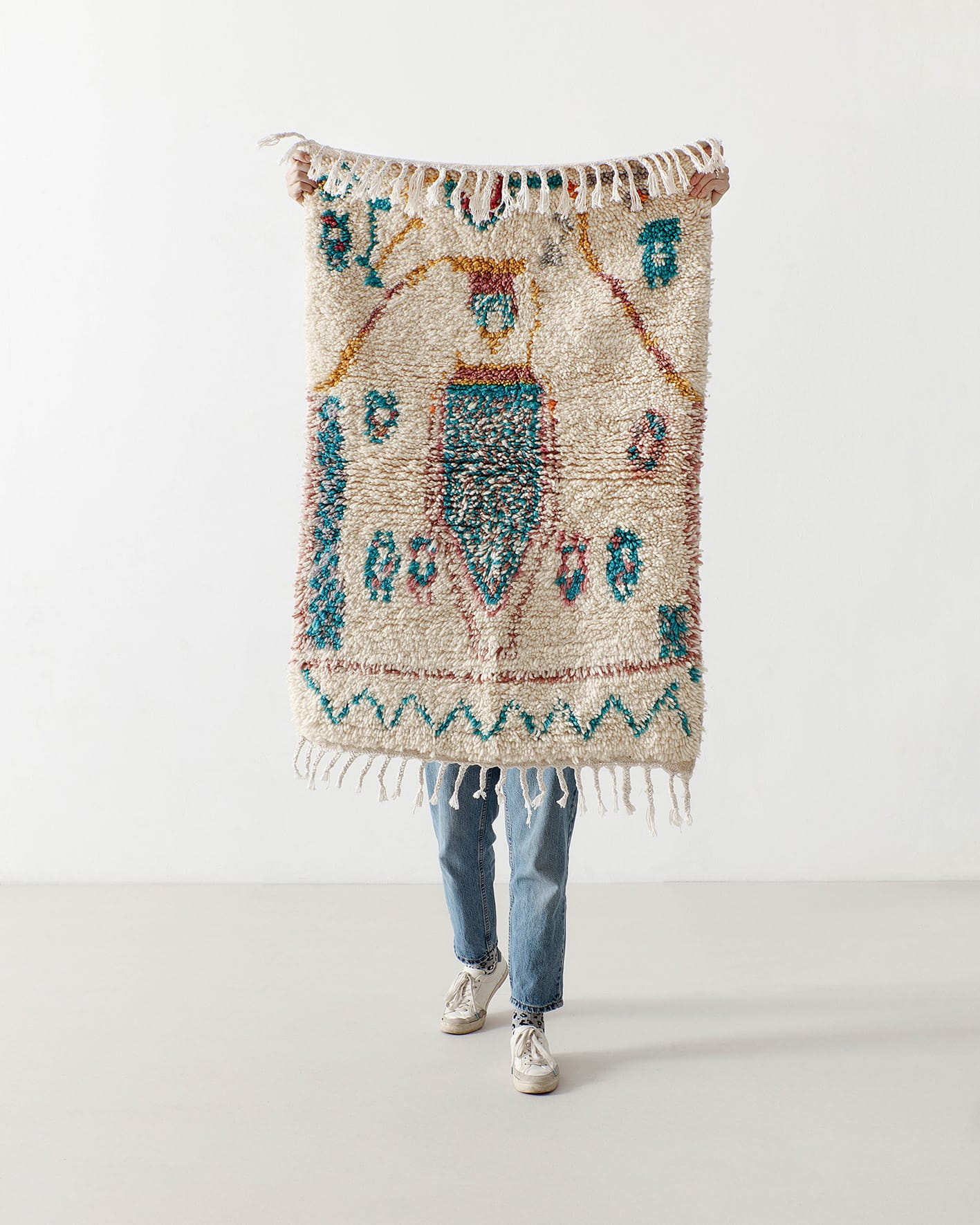 Tiny rug with turquoise motifs