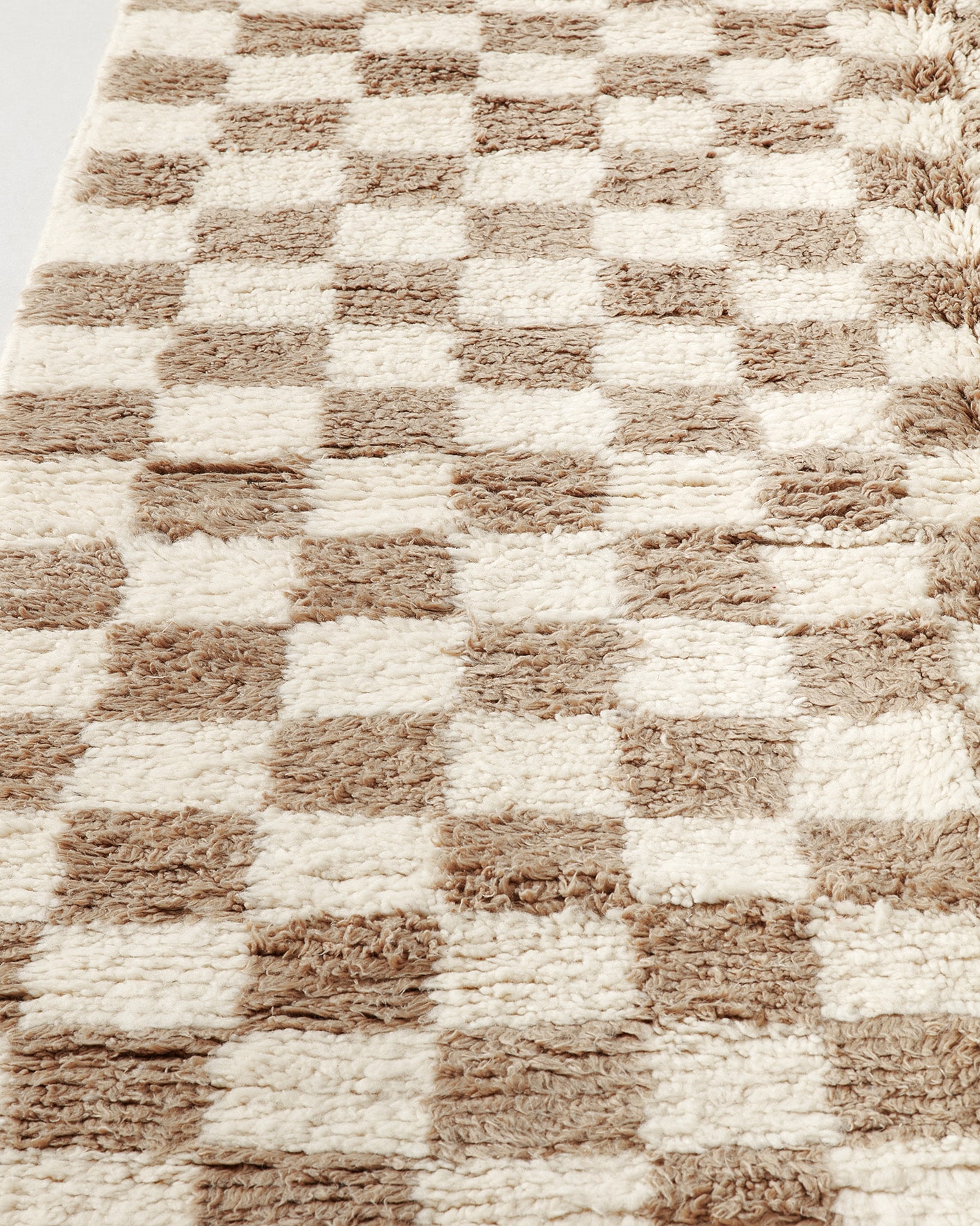 Light brown checkered rug, close