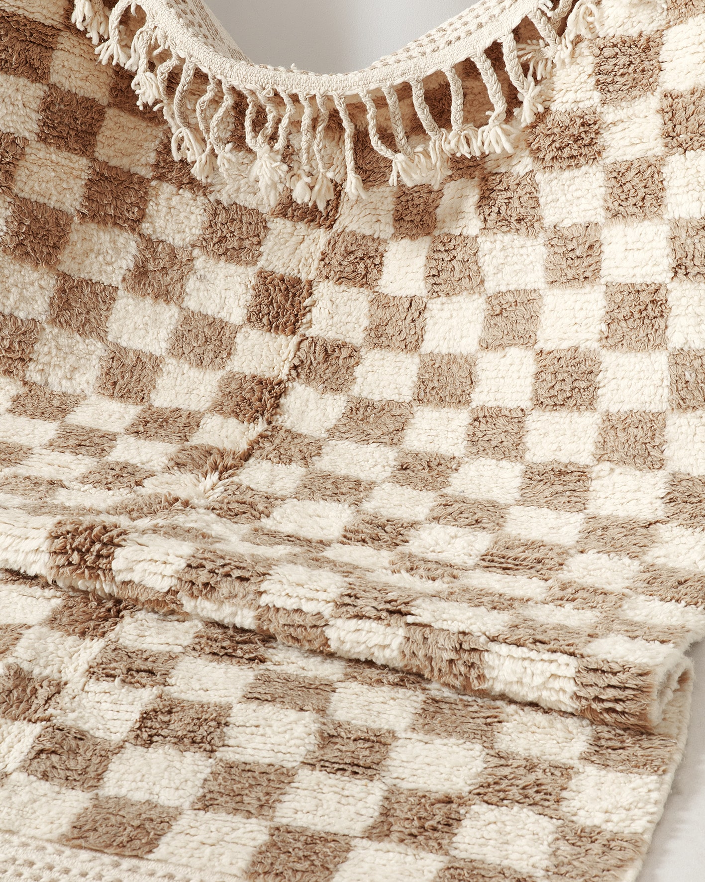 Light brown checkered rug, texture