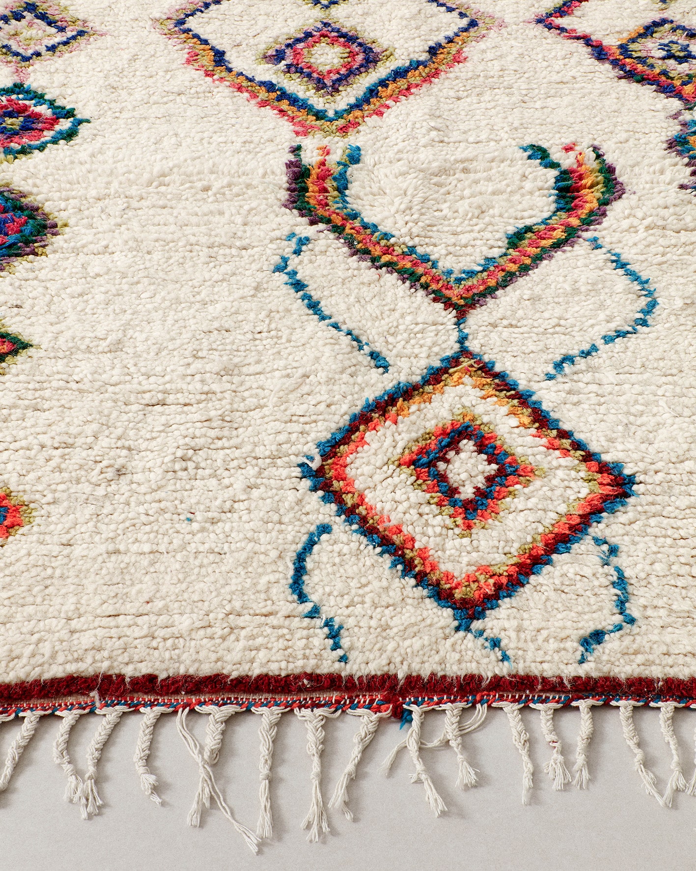 Small rug with colourful line drawings, fringe