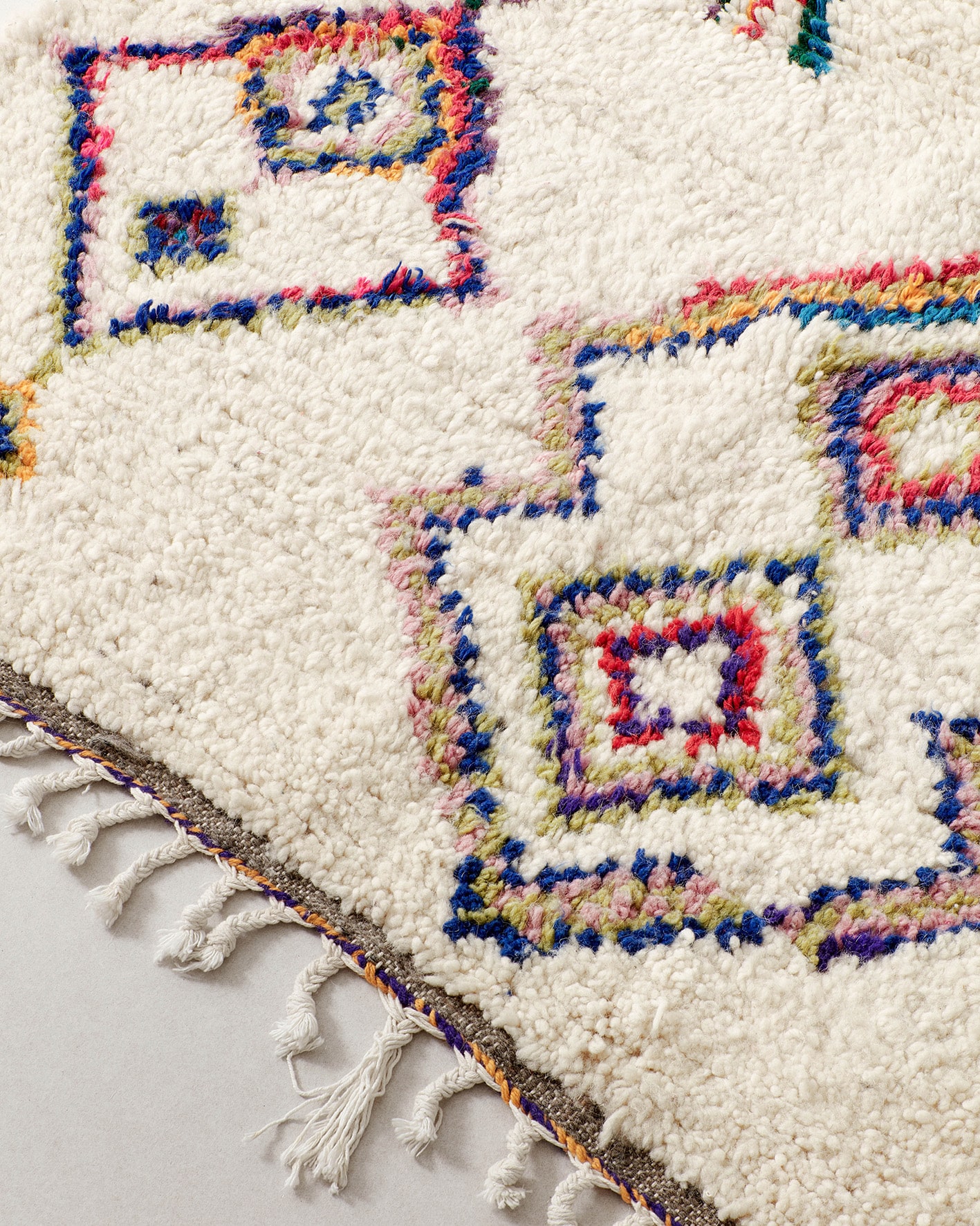 Small rug with colourful line drawings, close