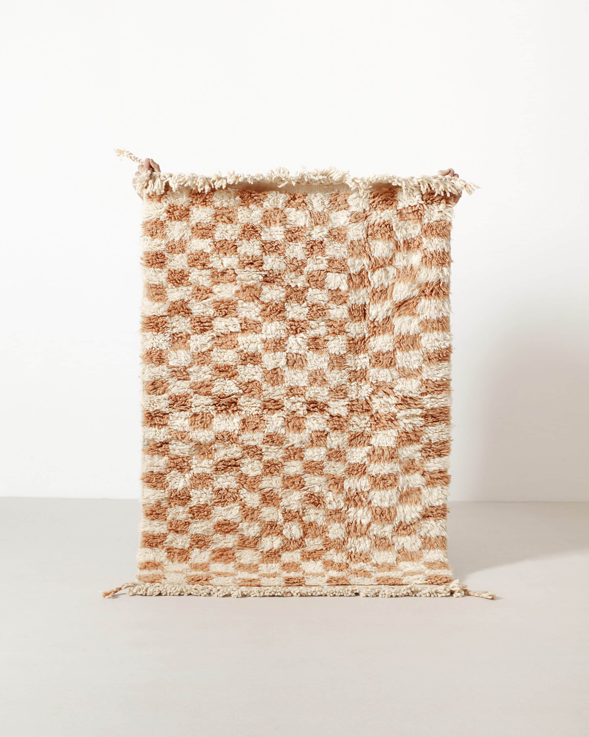 Tiny light brown checkered rug