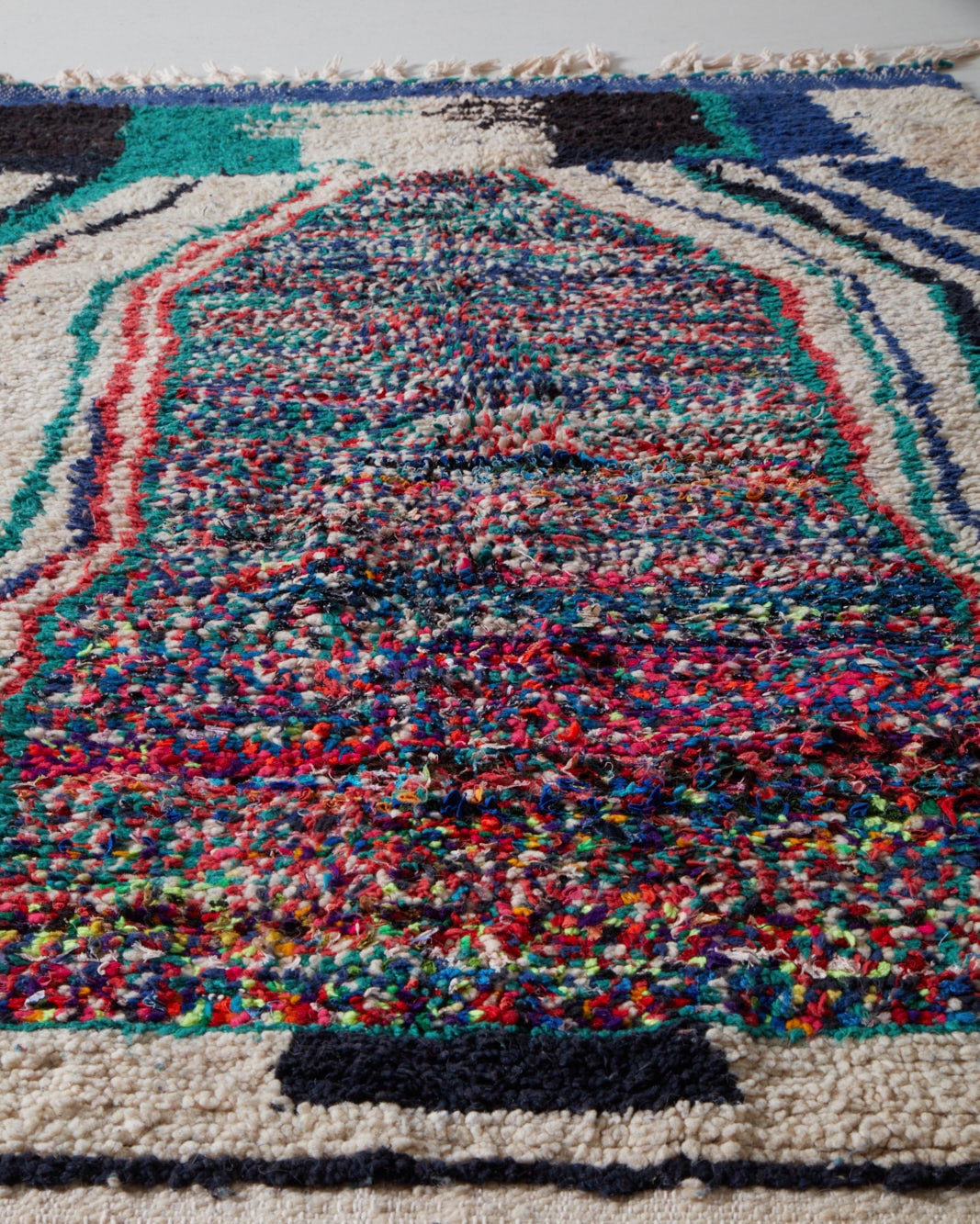Dark vintage rug adorned with neons, middle