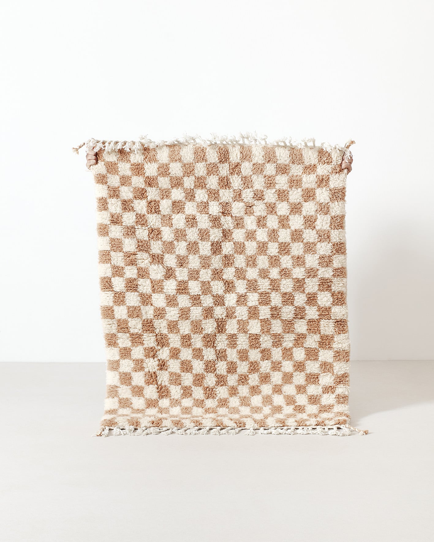 Light brown checkered rug