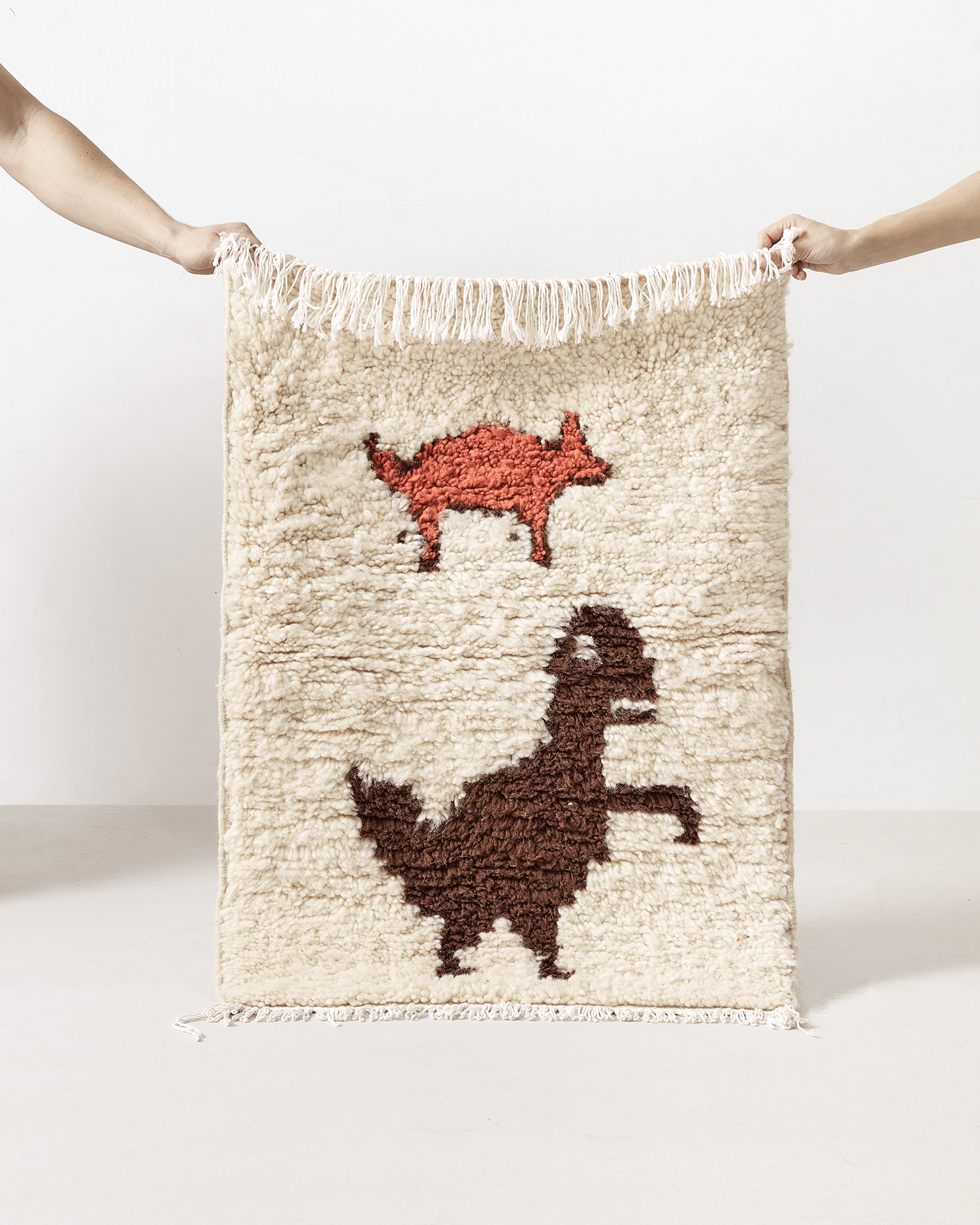 Tiny rug with a T-rex